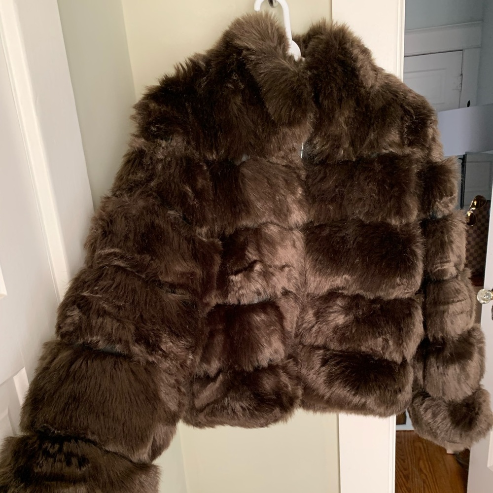 Faux fur brown jacket with leather detail.